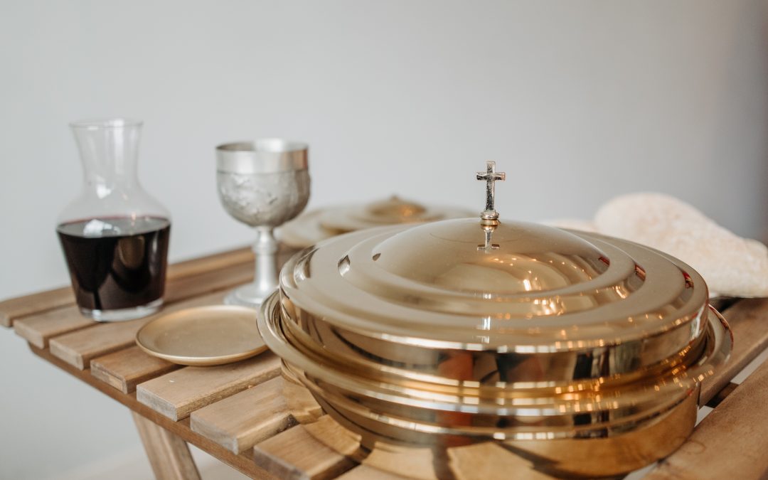 communion table prepared with bread and cup